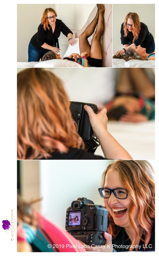 Photographer laughing with her client while photographing and showing the client the image of her on the back of her camera