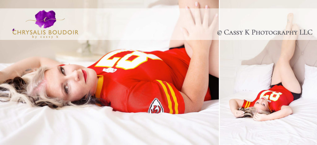 Blonde and black haired woman wearing Kansas City Chiefs jersey on a bed Boudoir Photoshoot