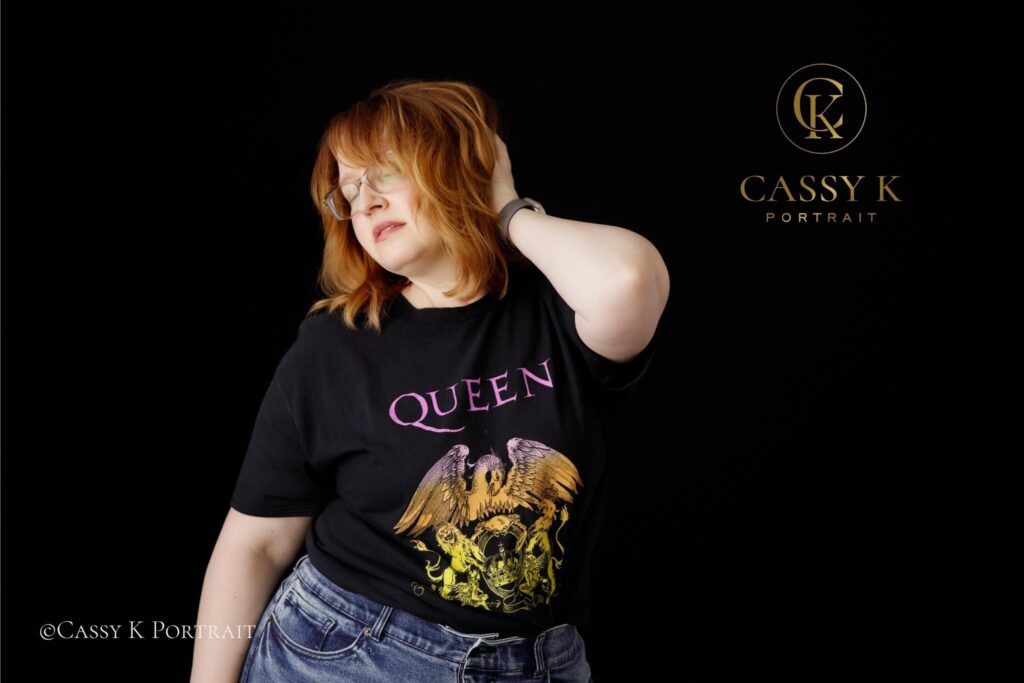 Wistful Blond hair and blue green eyed woman learns to love body image after 40 for headshot photo shoot