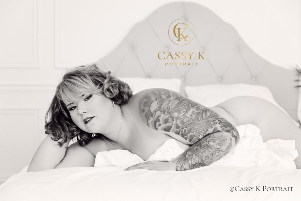 Blue and Purple haired woman does Black and white boudoir photo shoot for confidence