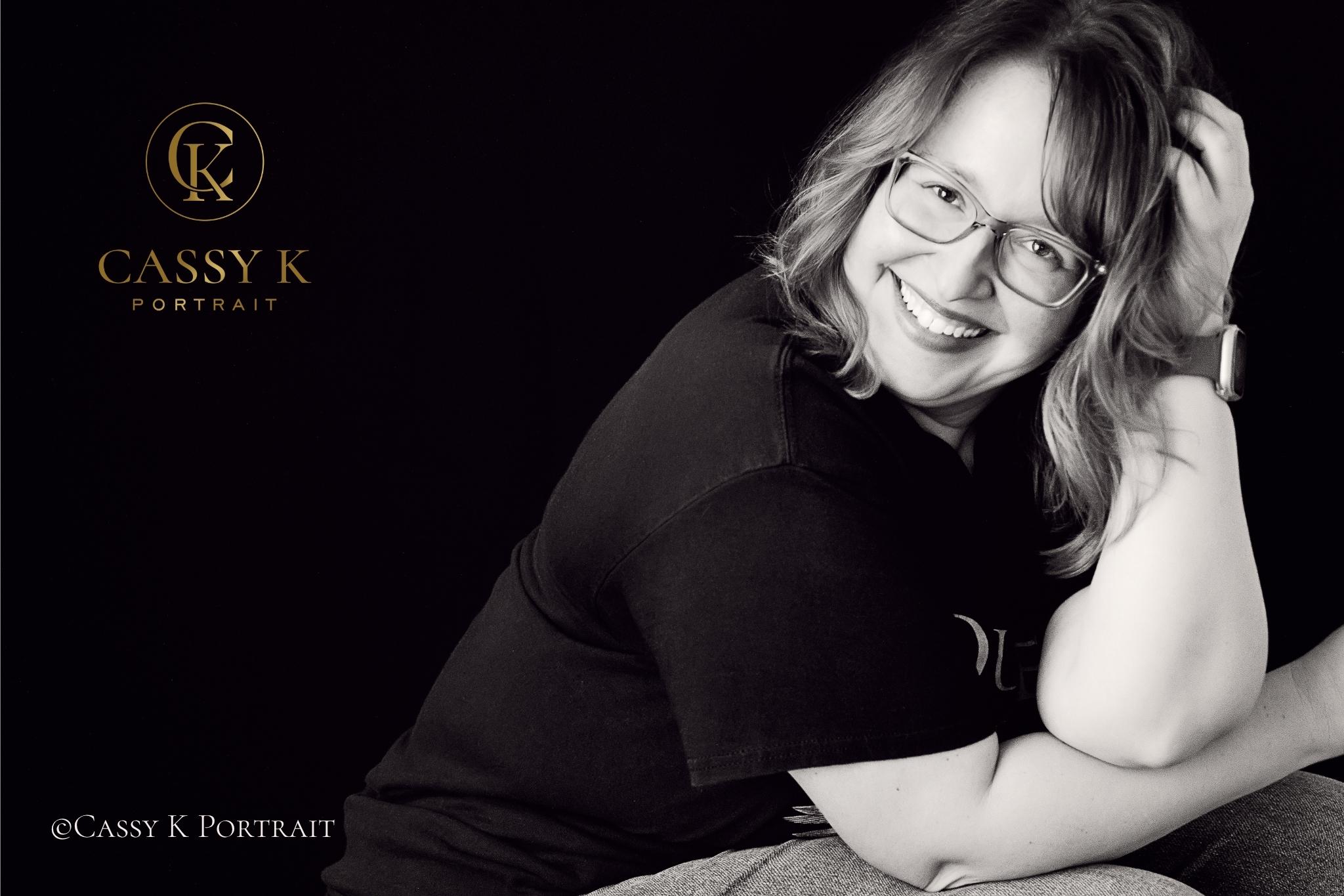 Blond hair and blue green eyed woman black and white smiling for headshot photography learning body image acceptance after 40