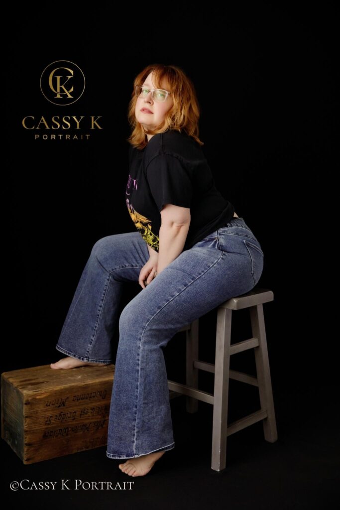 Sultry Blond hair and blue green eyed woman learns to love body image after 40 for headshot photo shoot