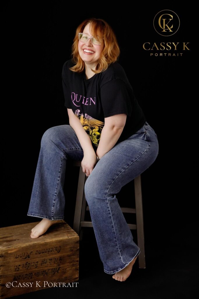 Happy Blond hair and blue green eyed woman learns to love body image after 40 for headshot photo shoot
